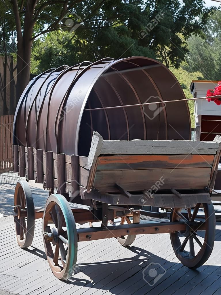 Antique Wooden Wagon With Wheels and Metal Structure.