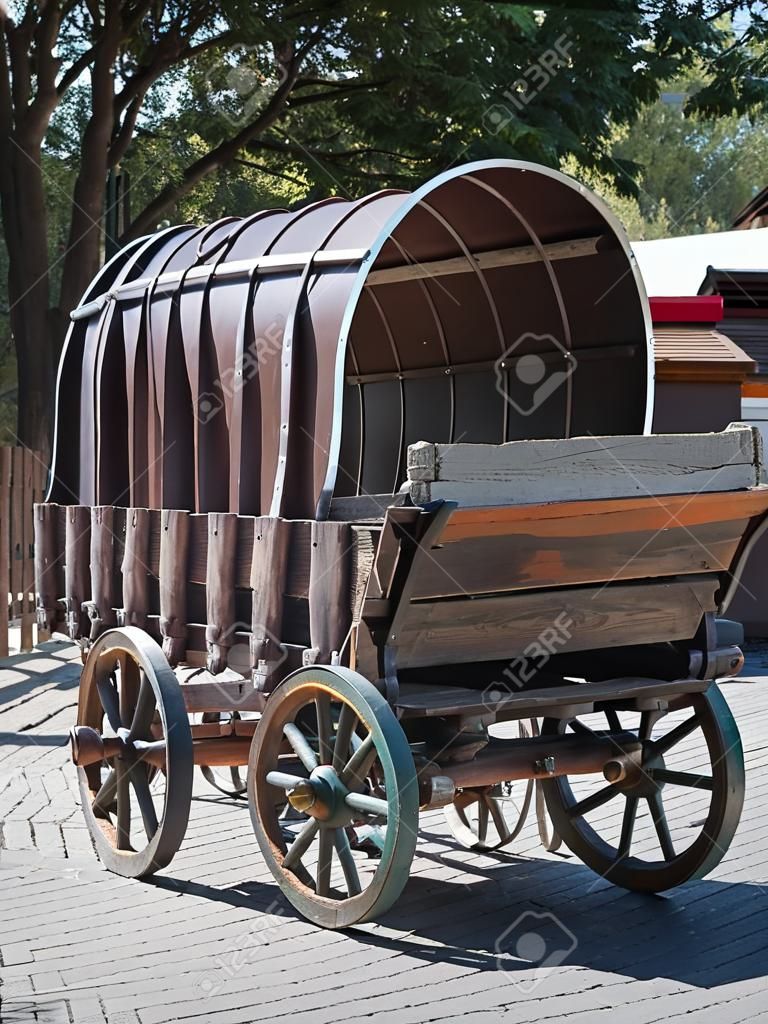 Antique Wooden Wagon With Wheels and Metal Structure.
