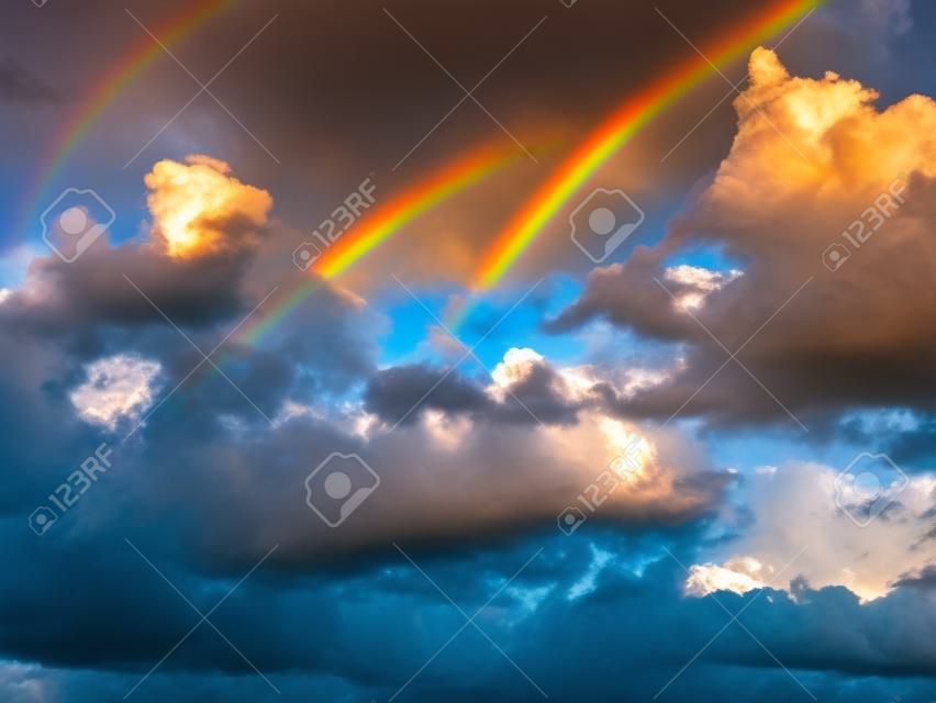 beautiful double rainbow cloudy blue sky