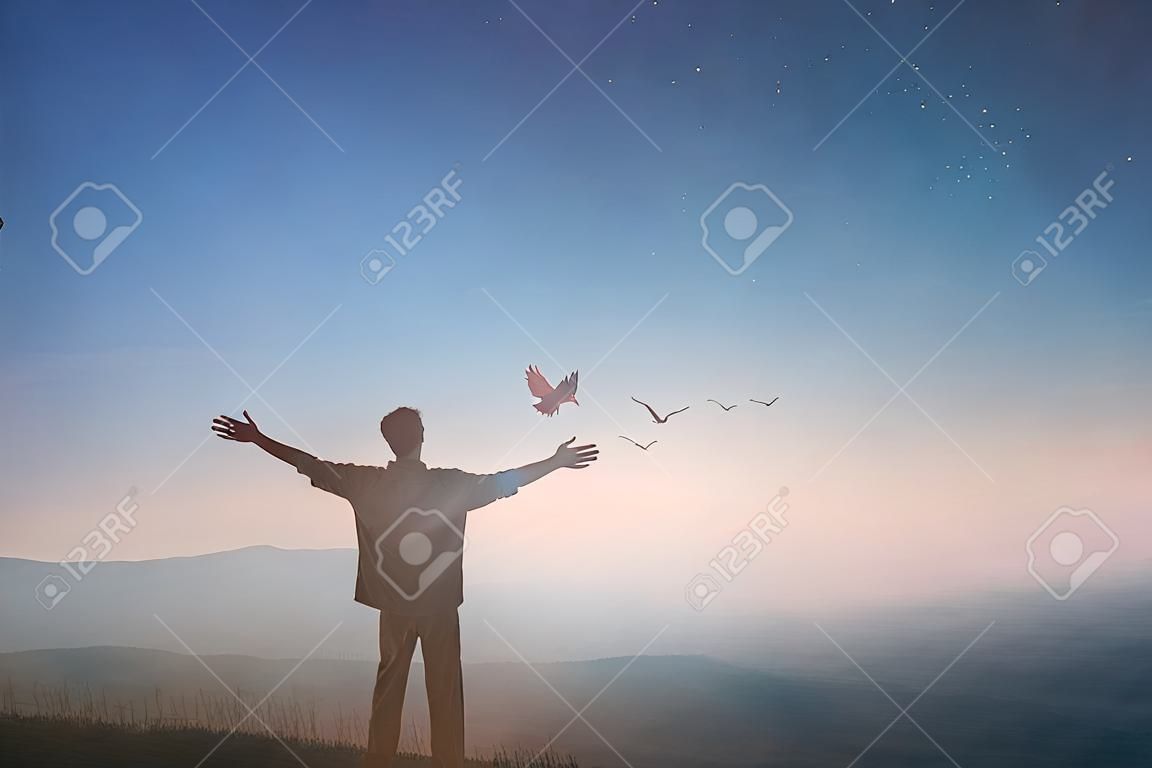 Happy man rise hand Worship God in morning view. Christian spirit prayer praise on good friday background. Male self confidence empowerment on mission arm concept strength wisdom ambitious