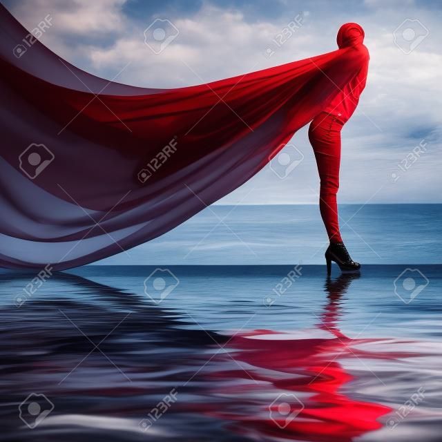 Woman with red scarf on water