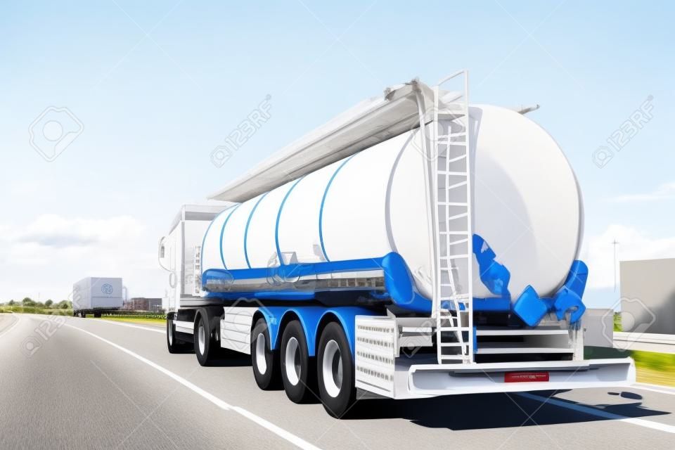 White big modern tanker shipment cargo commercial semi trailer truck moving fast on motorway road city urban suburb. Business distribution logistics service. Lorry driving highway sunny day