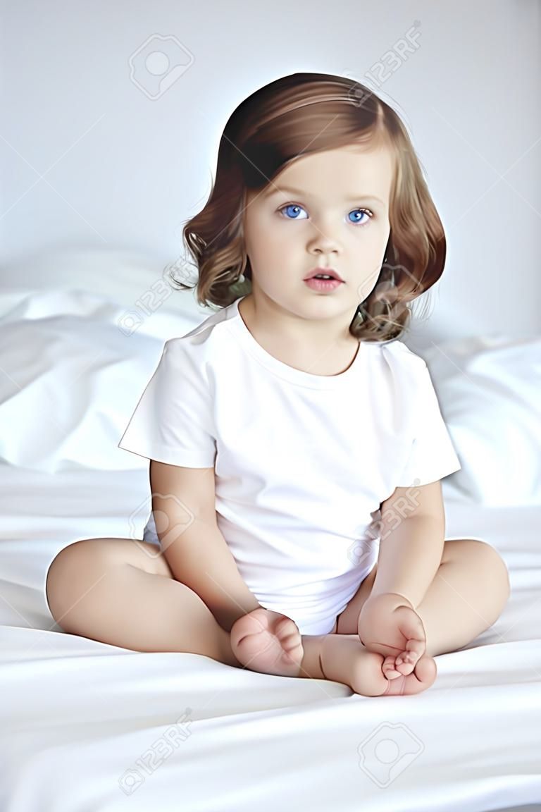 Girl sitting on bed 