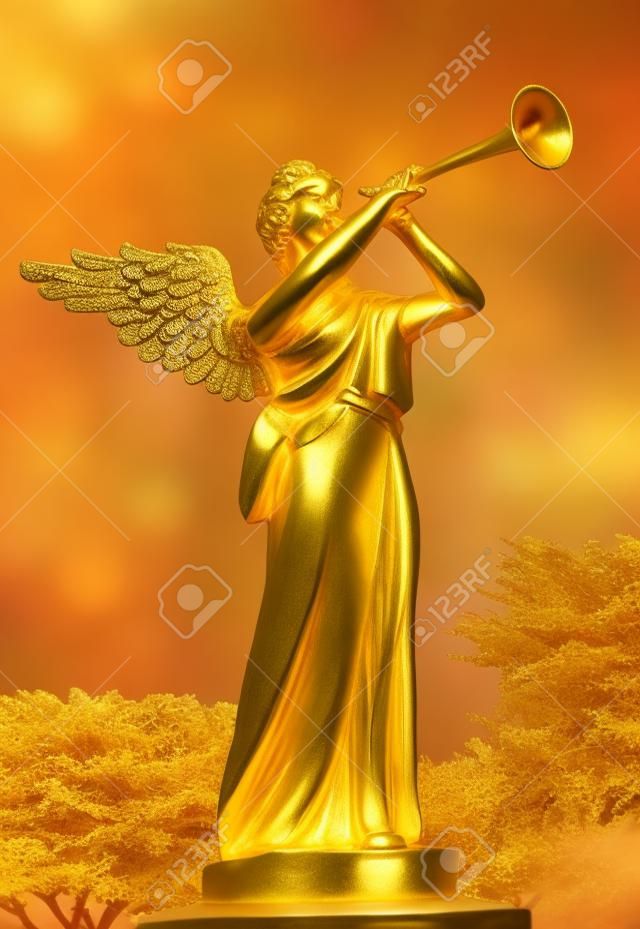 A trumpeting golden music angel statue