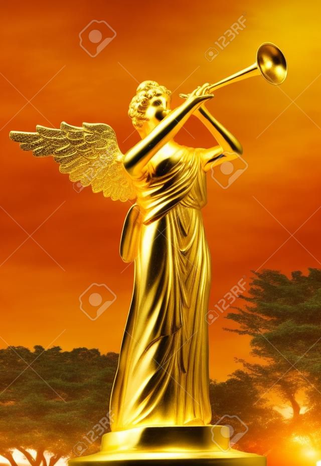 A trumpeting golden music angel statue