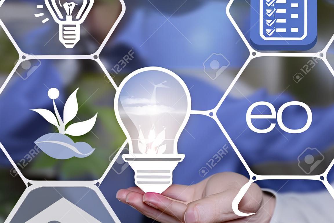 A light bulb in your hands and an ecology icon. The concept of clean energy.