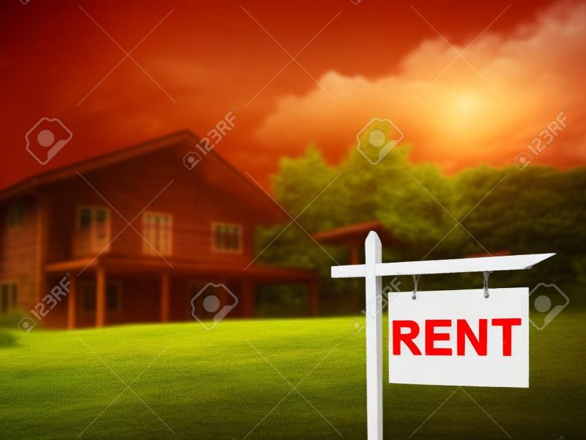 House for rent. Rent sign next on cottage. Wooden house with rent board. Country house near lease forest. lease suburban real estate. Leasing real estate. Red sign in front of cottage.