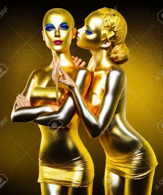 Bodypaint. Two Women Painted Gold. Carnival