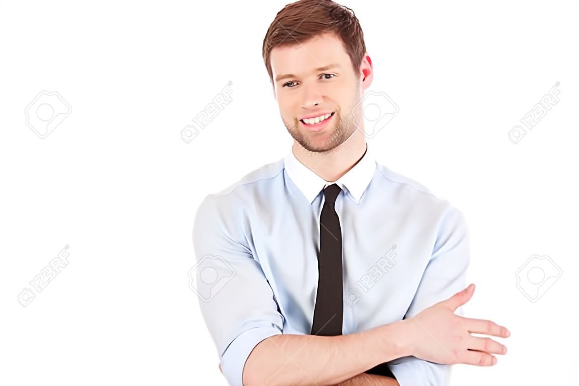 Businessman pointing copy space. Handsome young man in shirt and tie looking at camera and pointing away while standing isolated on white background