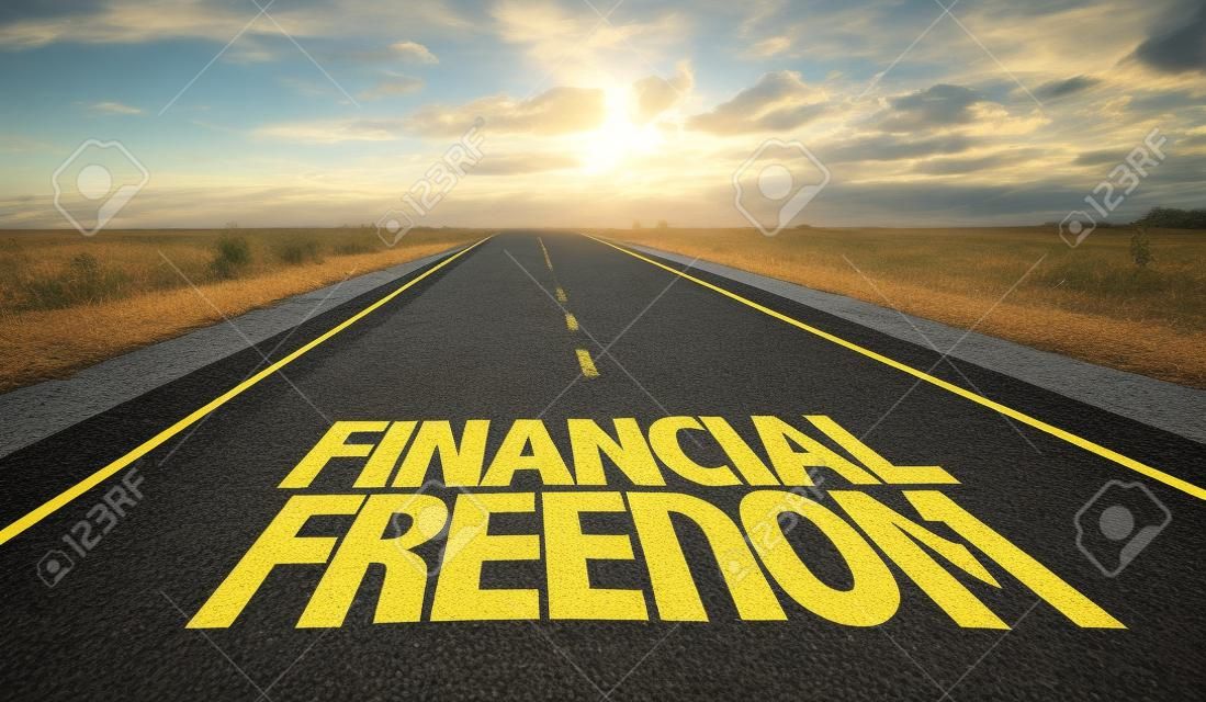 Financial freedom written on the road