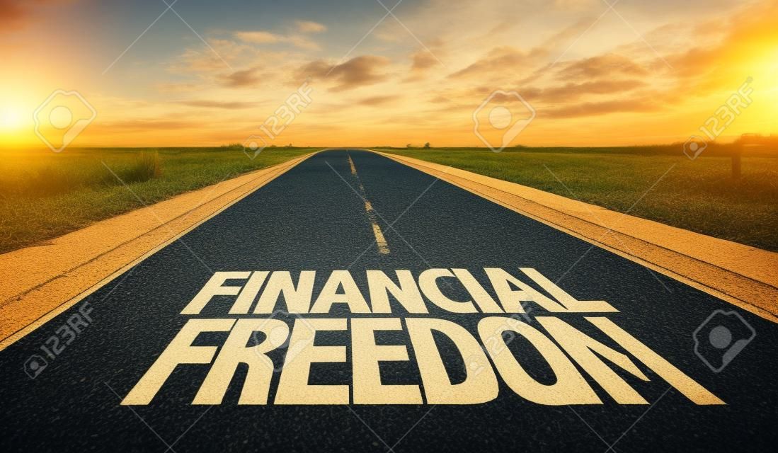 Financial freedom written on the road