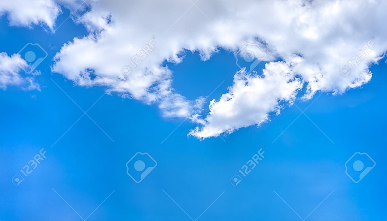 Clear sky and fluffy cloud  blue background