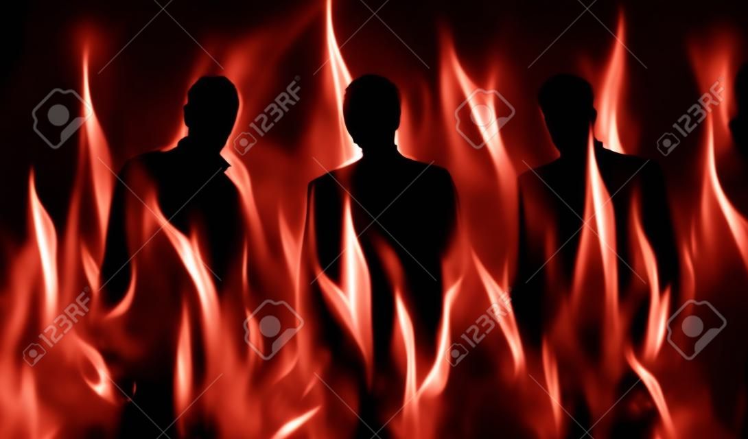 abstrakt beleuchtete Silhouetten von drei Personen in der Hölle