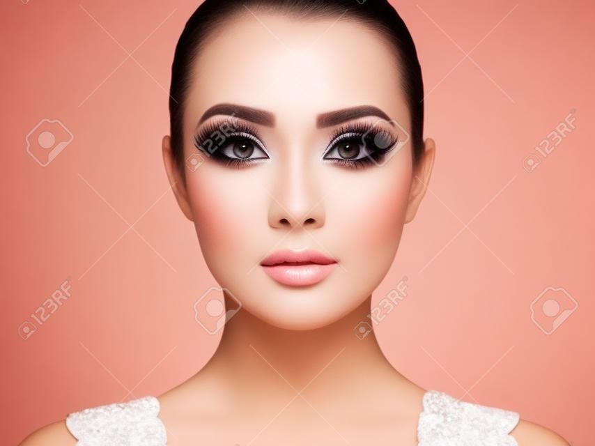 Beautiful woman face. Perfect makeup. Beauty fashion. Eyelashes. Cosmetic Eyeshadow