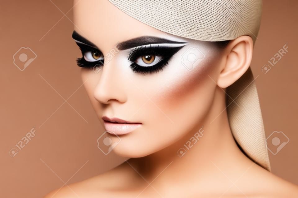 Beautiful woman face. Perfect makeup. Beauty fashion. Eyelashes. Cosmetic Eyeshadow. Highlighting. Black and white