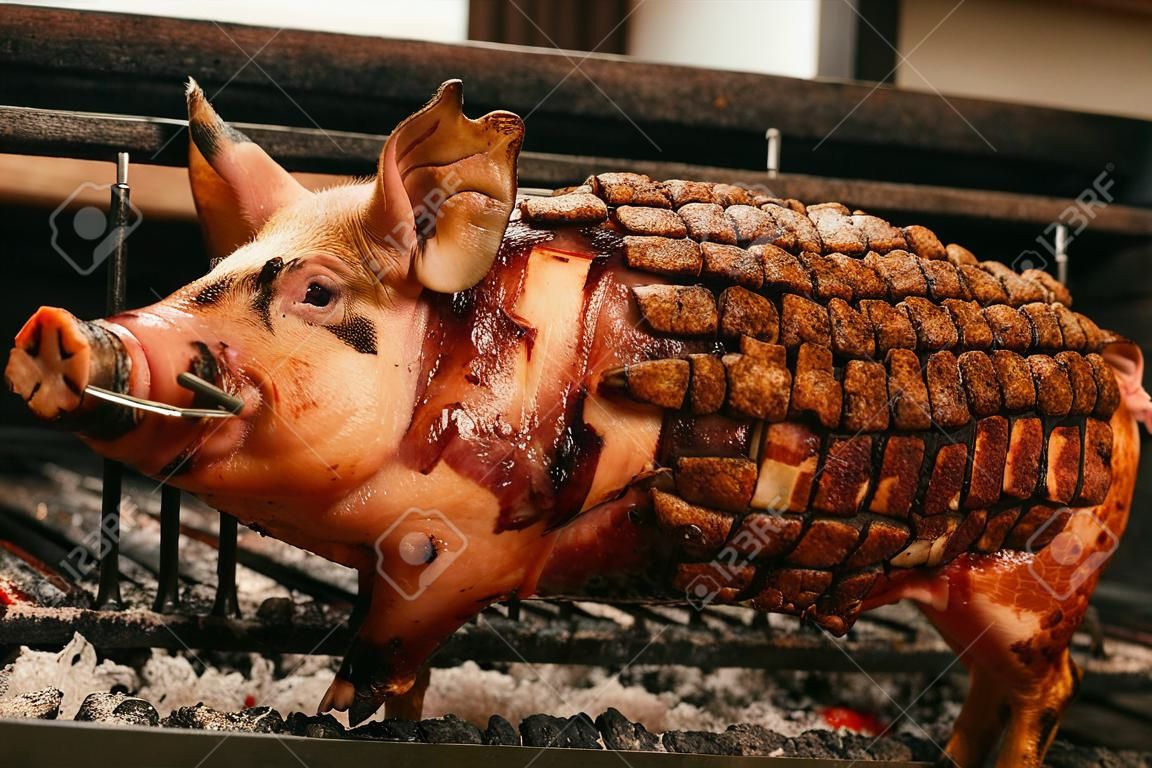 Detailed view of a roasted pig's skin on a spit