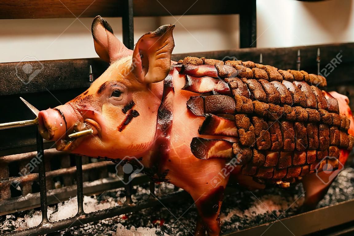 Detailed view of a roasted pig's skin on a spit