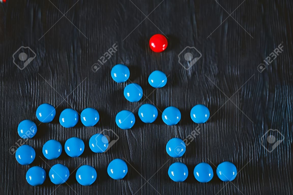 Two groups of candies in different colors symbolizing the parties to the negotiations