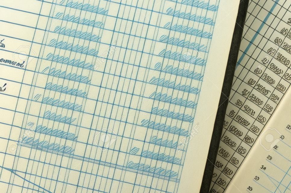 Handwritten accounting on the open pages of some old ledgers