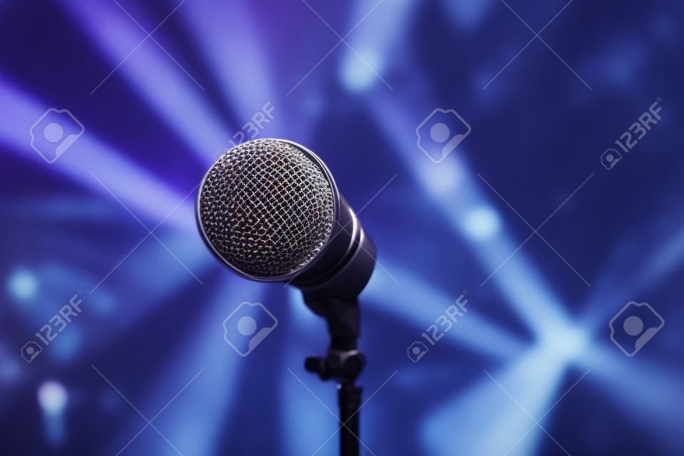 Microphone on stage on a blurry background from a close angle