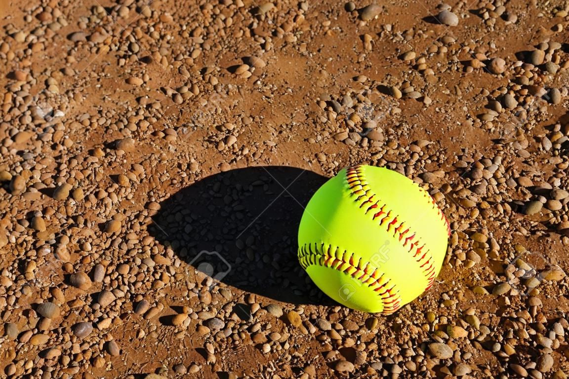 Yellow Softball on the Infield Dirt