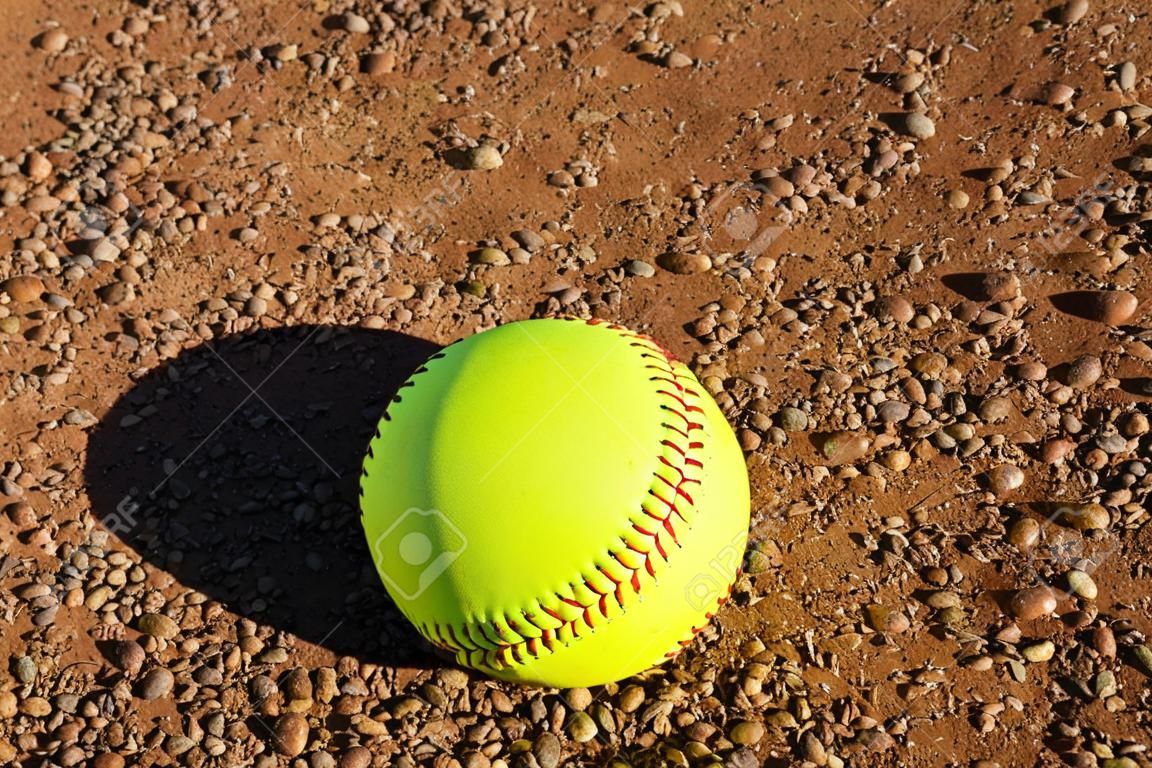 Yellow Softball on the Infield Dirt