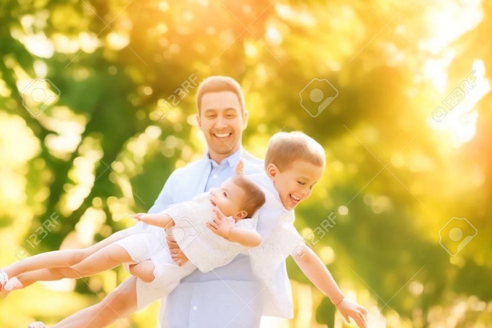 Cute family playing in a summer park