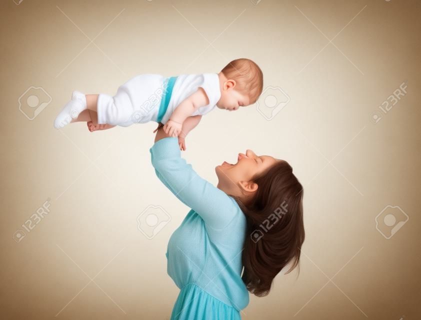 Happy mother playing with her baby son (isolated on white)