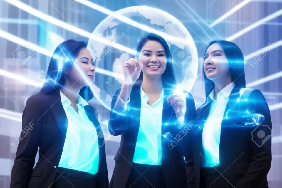 Three business women of different ethnicities, dressed in business suits, and talking about finance and economics looking at futuristic charts with holography. Concept of: female career, technology
