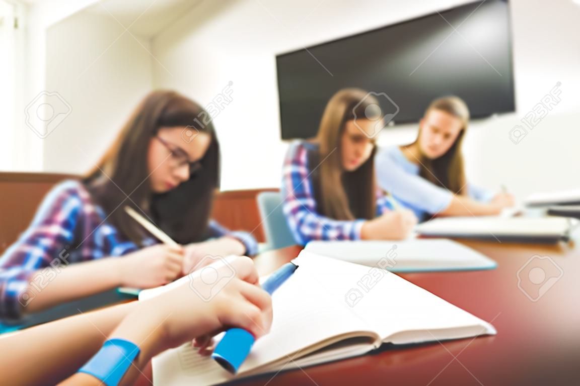 Serious girls in modern classroom