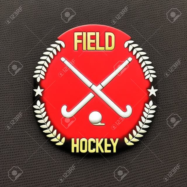 El campo equipo de hockey insignia del club deportivo con dos palos de hockey y balón