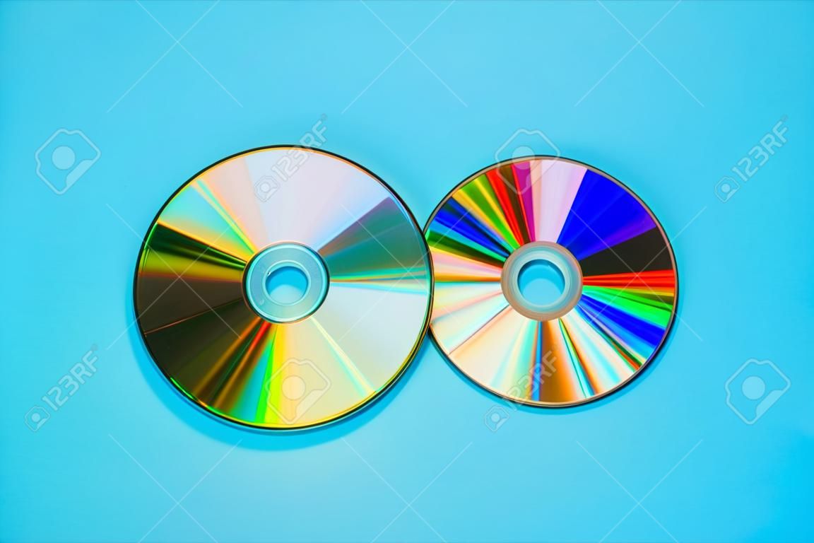 Compact disc (CD) on blue background for audio and data storage