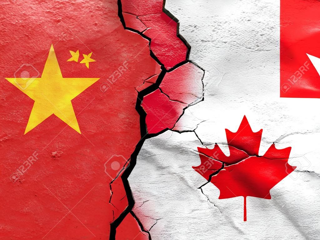 China and Canada flags on cracked concrete (International conflict concept)