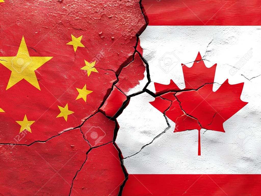 China and Canada flags on cracked concrete (International conflict concept)