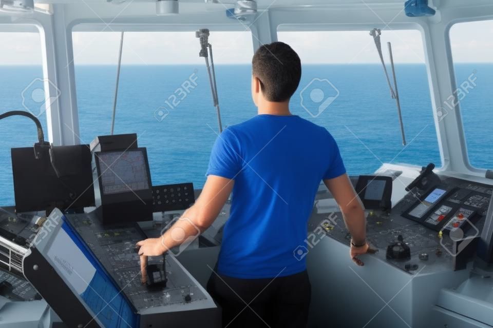 Marine navigational officer is maneuvering ship or vessel