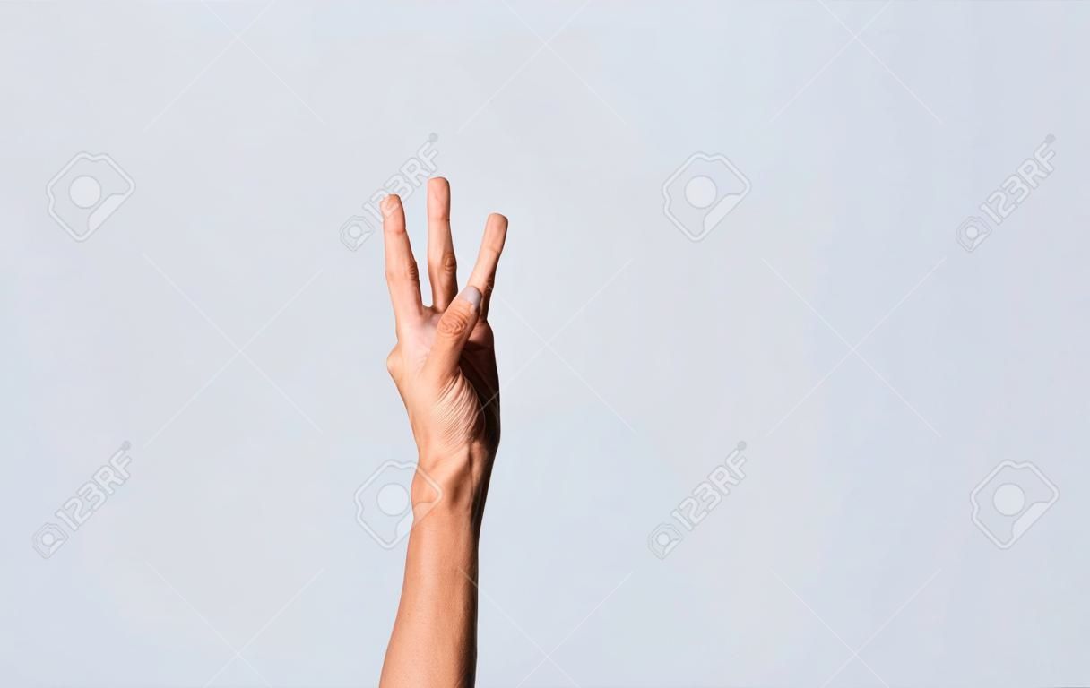 Number SEVEN in sign language. Fingers counting the number SEVEN in sign language, Fingers of people counting number SEVEN in sign language. Concept of numbers in sign language