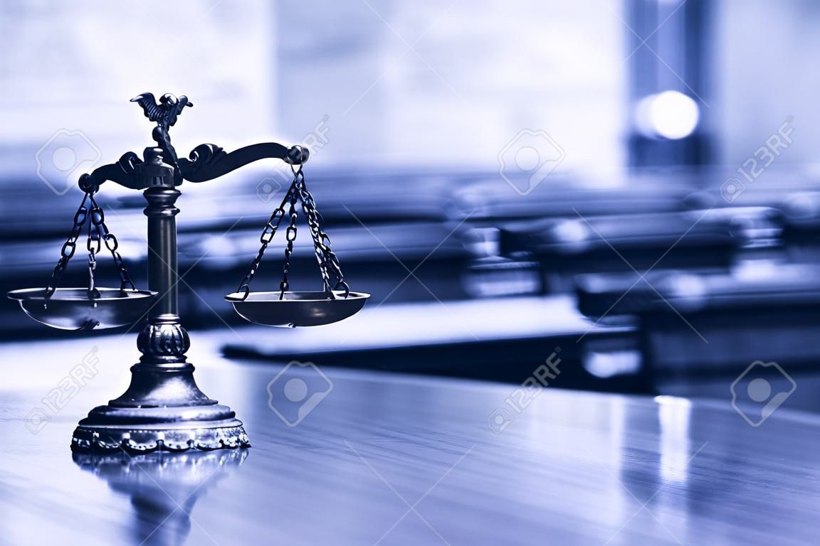 Symbol of law and justice in the empty courtroom, law and justice concept , blue toned.