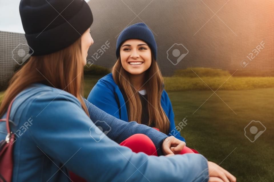 Female friends sitting outside having a chat