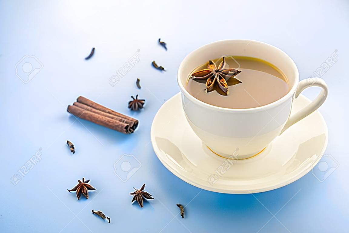 Traditional Indian Masala Chai Tea In White Cup With Spiced. With Copy  Space. Blue Background Stock Photo, Picture and Royalty Free Image. Image  141057782.