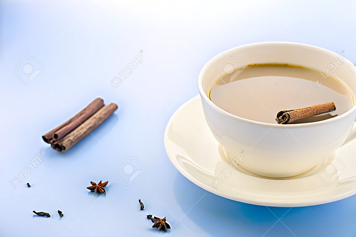 Traditional Indian Masala Chai Tea In White Cup With Spiced. With Copy  Space. Blue Background Stock Photo, Picture and Royalty Free Image. Image  141057782.