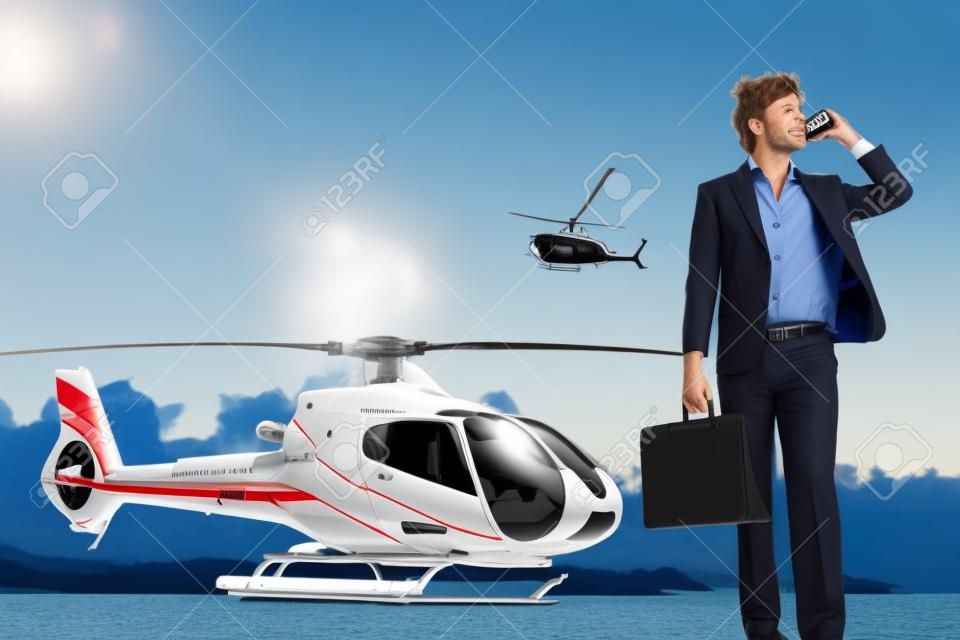Businessman talking on the phone with helicopter in the background