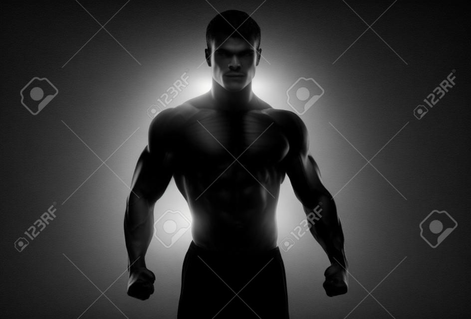 Dunkle Silhouette eines starken Mannes auf weißem Hintergrund. Zuversichtlich junge Fitness Mann mit starken Händen und ballte die Fäuste. Clipping-Pfad im Inneren