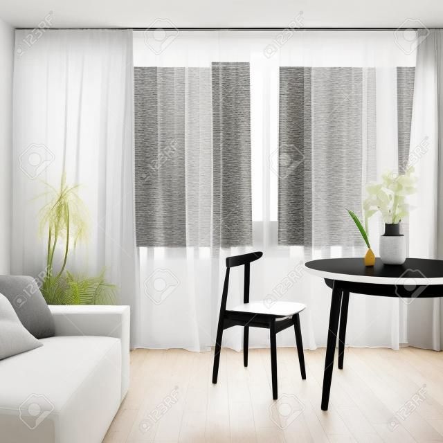 Wooden dining table with nice decorations and black chair in living room with window wall behind white curtains, wooden floor and gray sofa