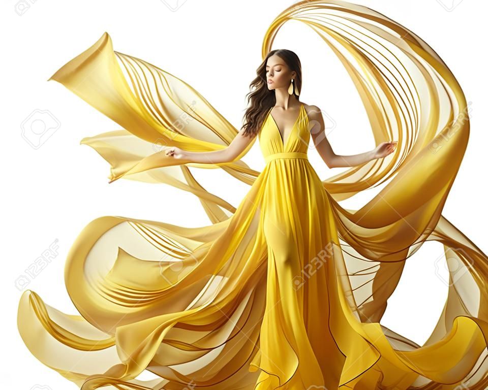 时尚模特裙女在流动织物长袍的衣服上流着风白色的黄色