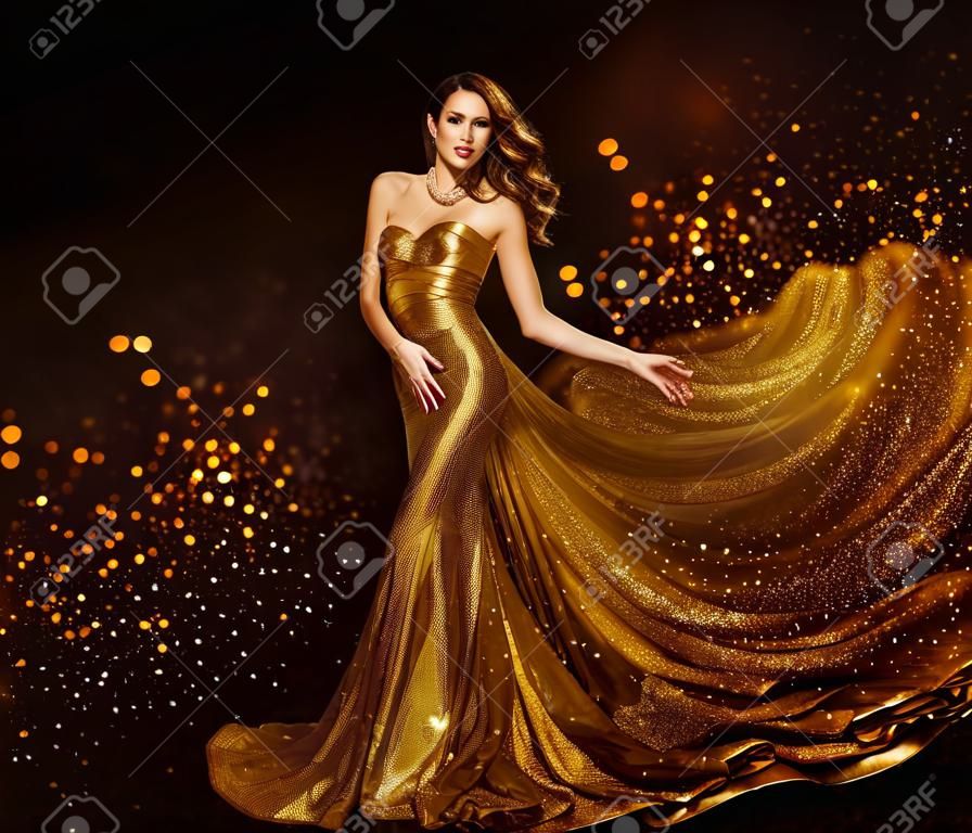 Fashion Woman Gold Dress, Luxury Girl in Elegant Golden Fabric Gown, Flying Sparkles Cloth