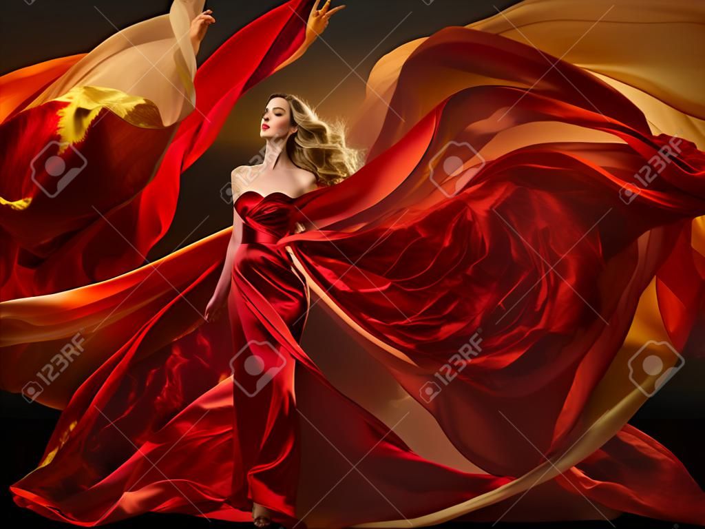 여자 패션 드레스 비행 빨간색 패브릭, 아름 다운 소녀 바람에 실크 옷을 흔들며