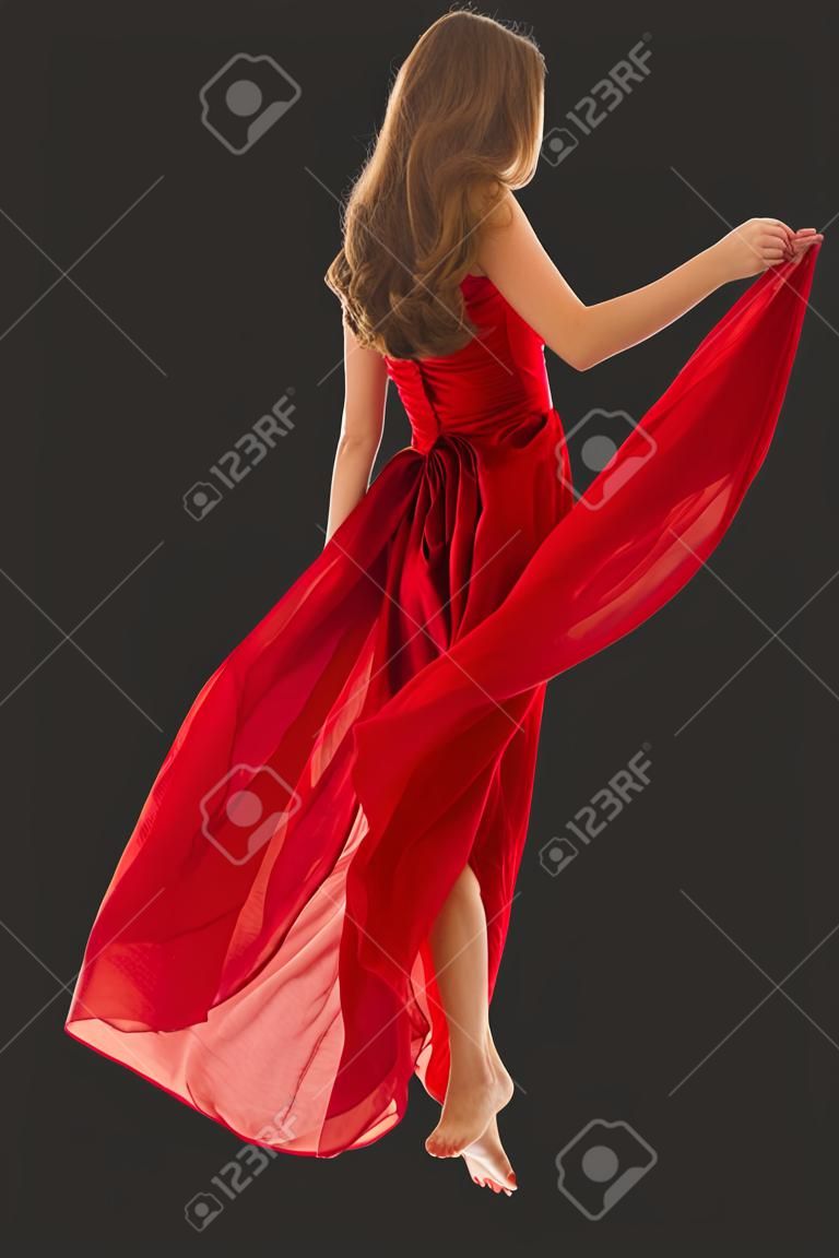 바람에 펄럭이는 빨간 드레스를 입고 걷는 여자 뒤 뒷모습, 흰색 위에 옷을 흔들며 부는 소녀
