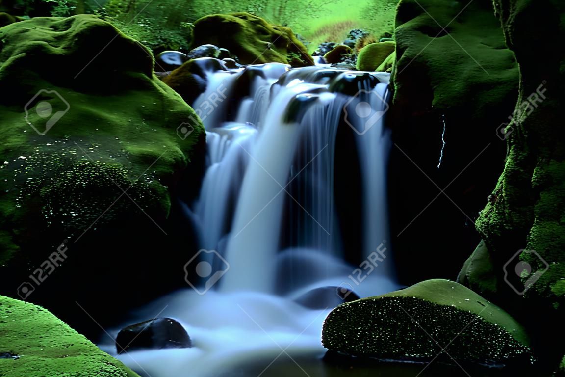 Beautiful landscape of flowing water from mountain stream 