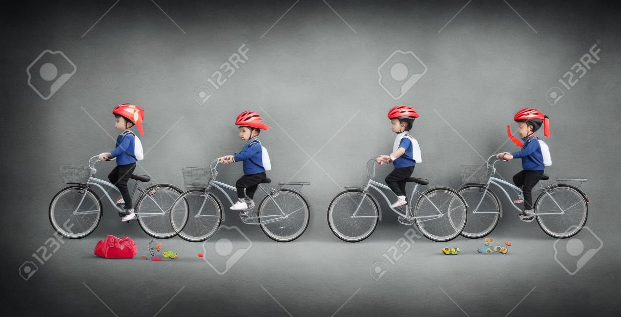 Children carrying a bicycle bag with a gray background