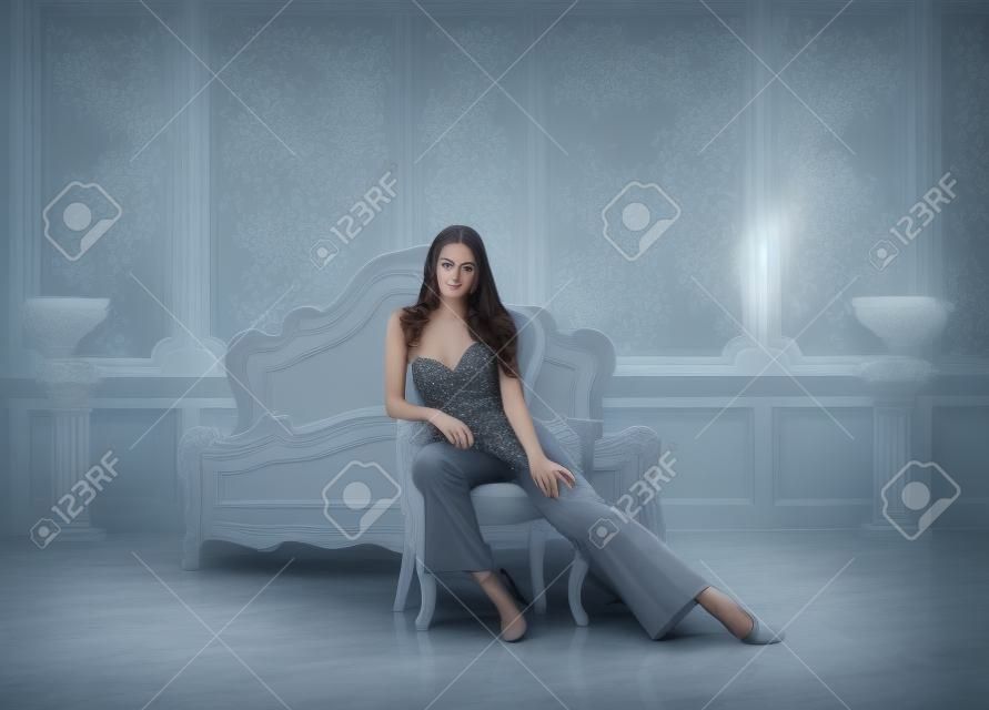 beauty young brunette woman in luxury home interior, fairy bedroom grey